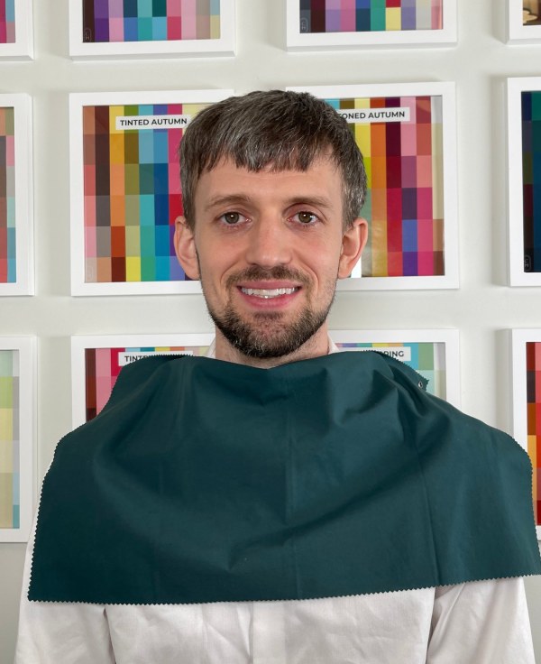After: the client in a deep teal drape from his palette