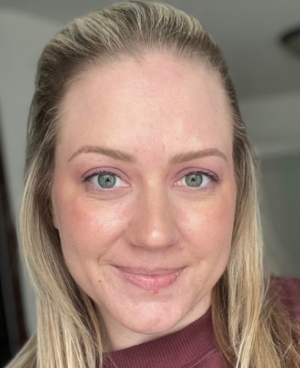 After: the client in a deep berry top from her palette